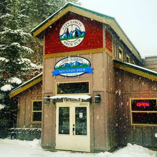 Outside snowy view of City Limits Pub & Grill