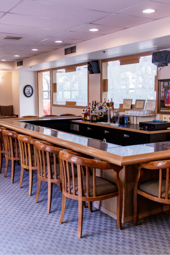 The O'Rourke's Lounge bar with wooden chairs and blue tiling